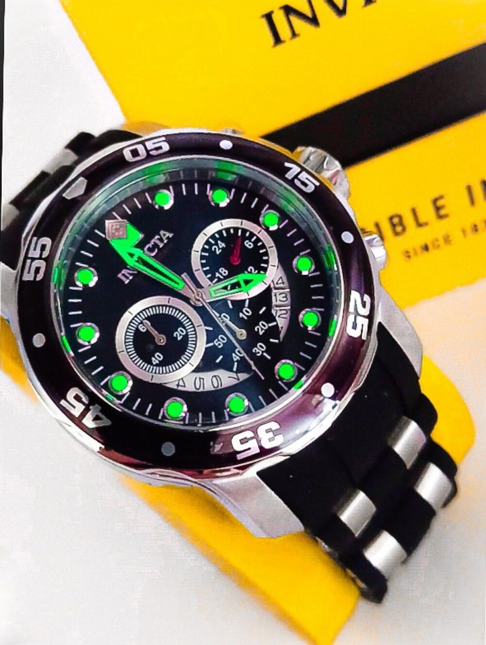 Invicta Black Watch with Green Accents and Silver Tone